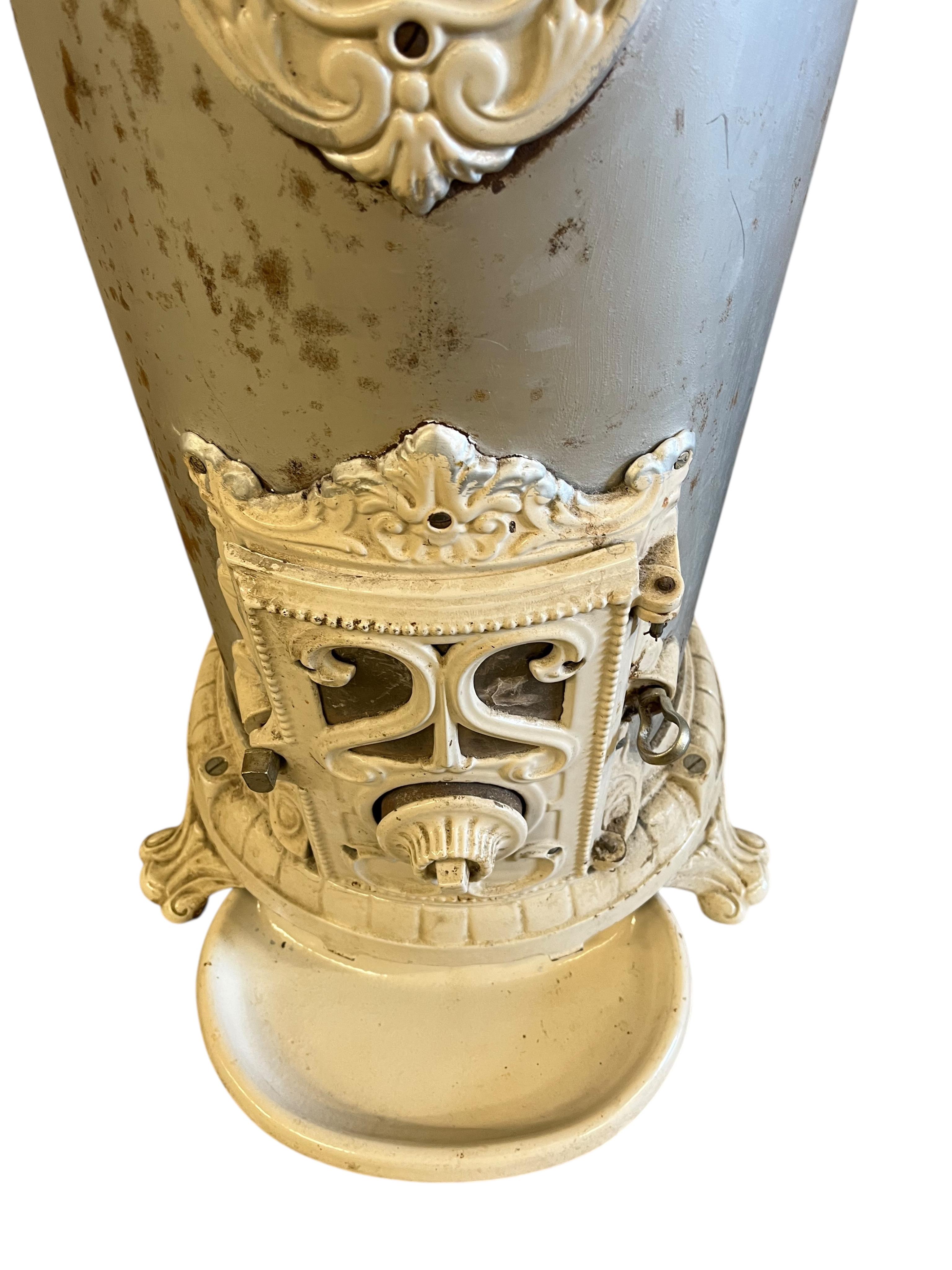 A 19th century French Godin cast iron stove, height 96cm